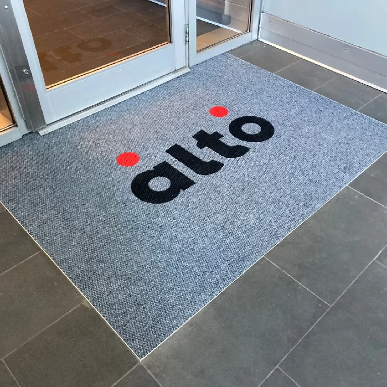 Weather-resistant entrance mat designed to trap dirt and moisture for commercial spaces